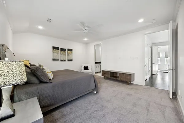 a bedroom with a bed and a couch
