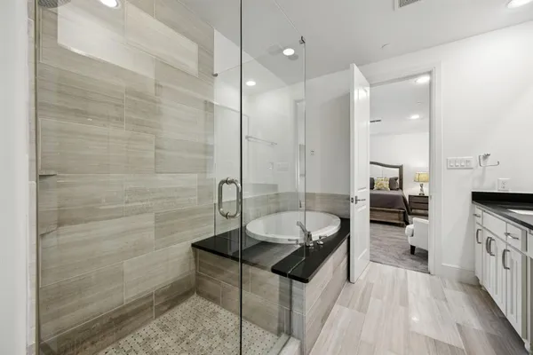 a spacious bathroom with a sink a mirror and a shower