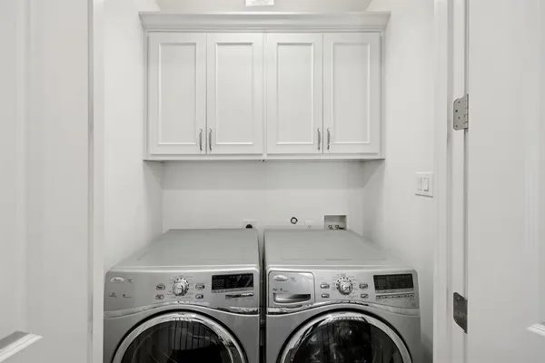 a view of entryway with washer and dryer