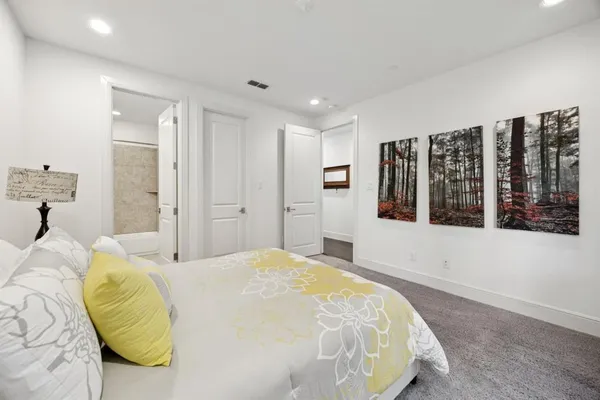 a bedroom with a bed and window