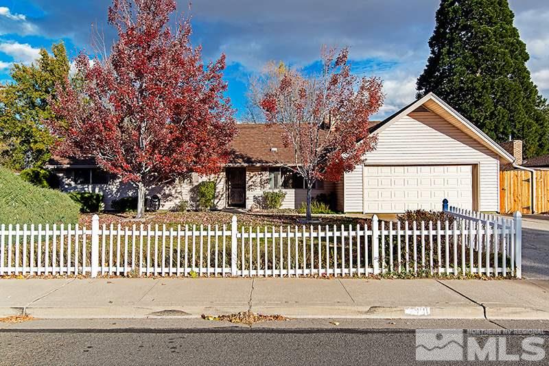 a view of a house with a fence