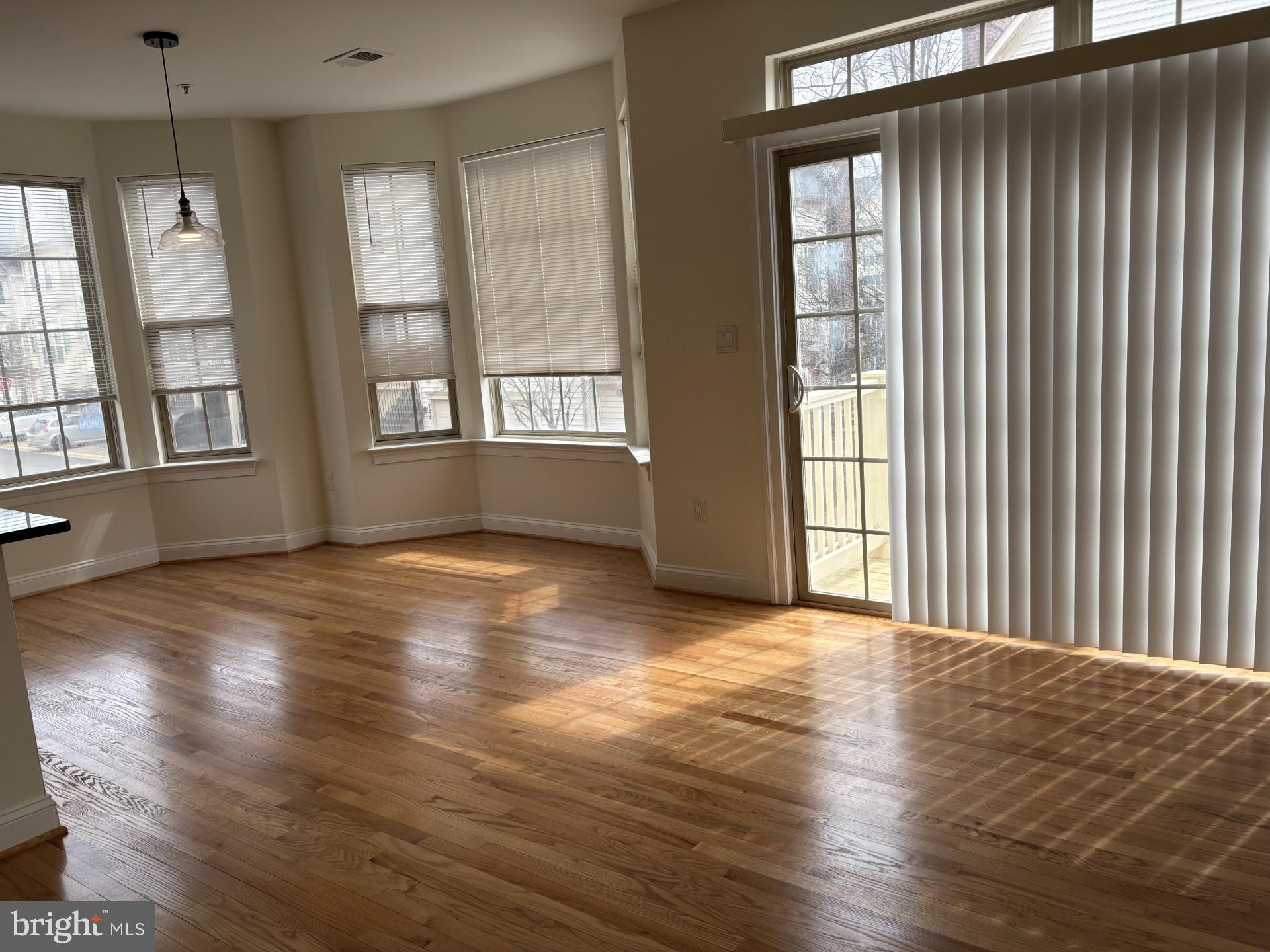 46378 Monocacy Square, Unit 86 Sterling, VA 20165 - Photo 18 of 22 a view of an empty room with wooden floor and a window