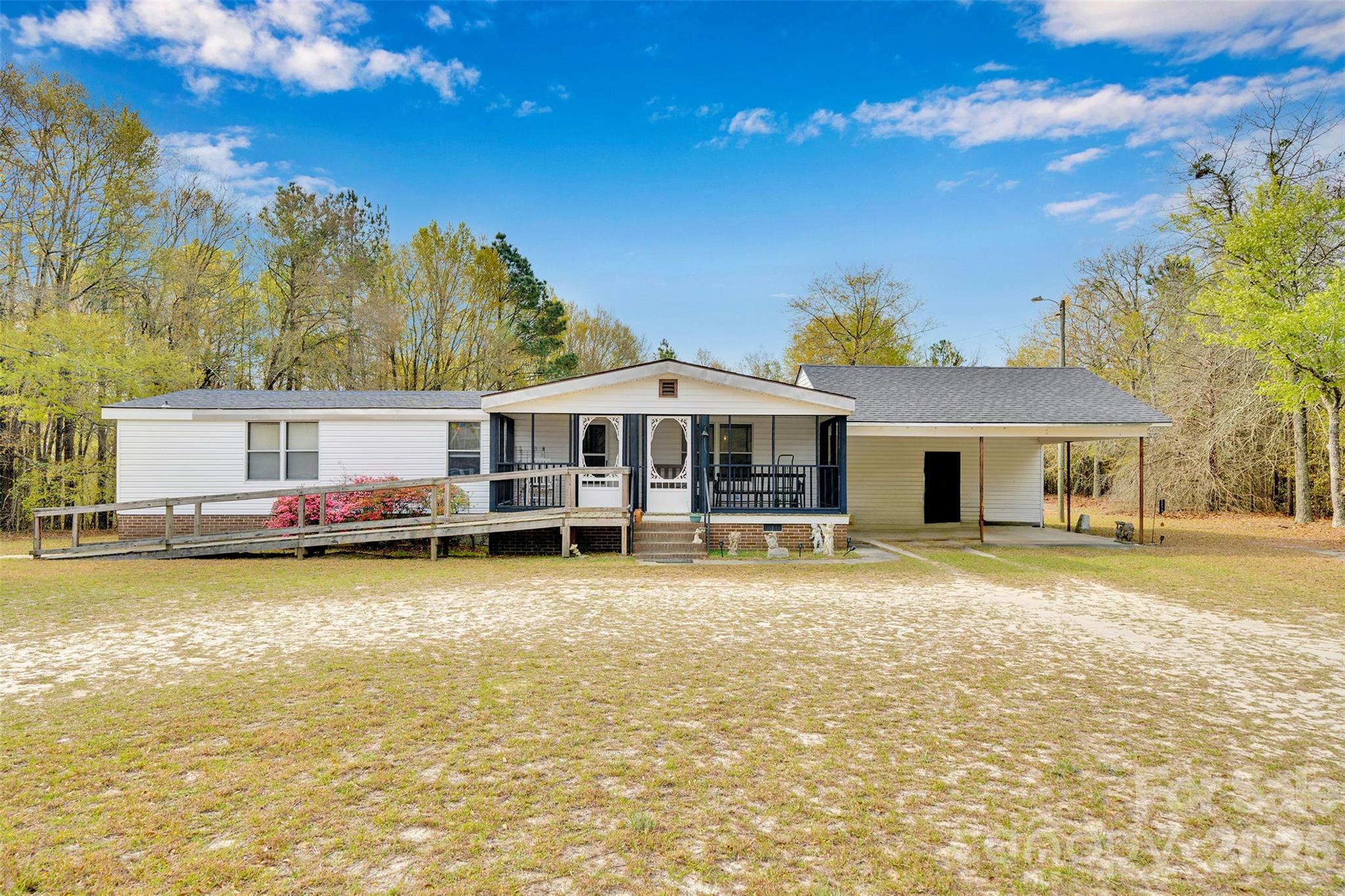 2187 McBee Highway Bethune, SC 29009 - Photo 1 of 38 a view of a house with pool and a yard