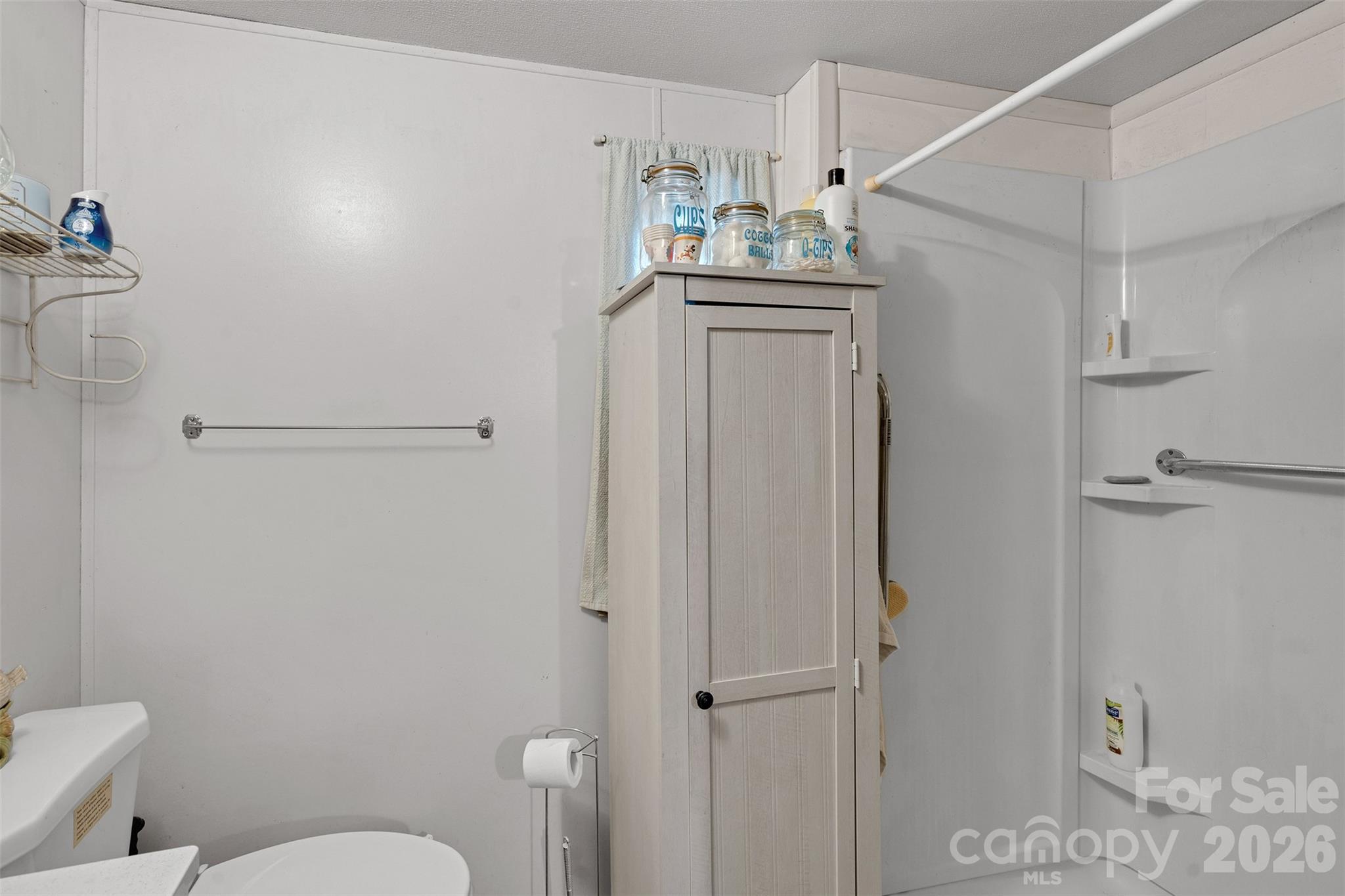 2187 McBee Highway Bethune, SC 29009 - Photo 22 of 38 a bathroom with a granite countertop sink a toilet and a shower