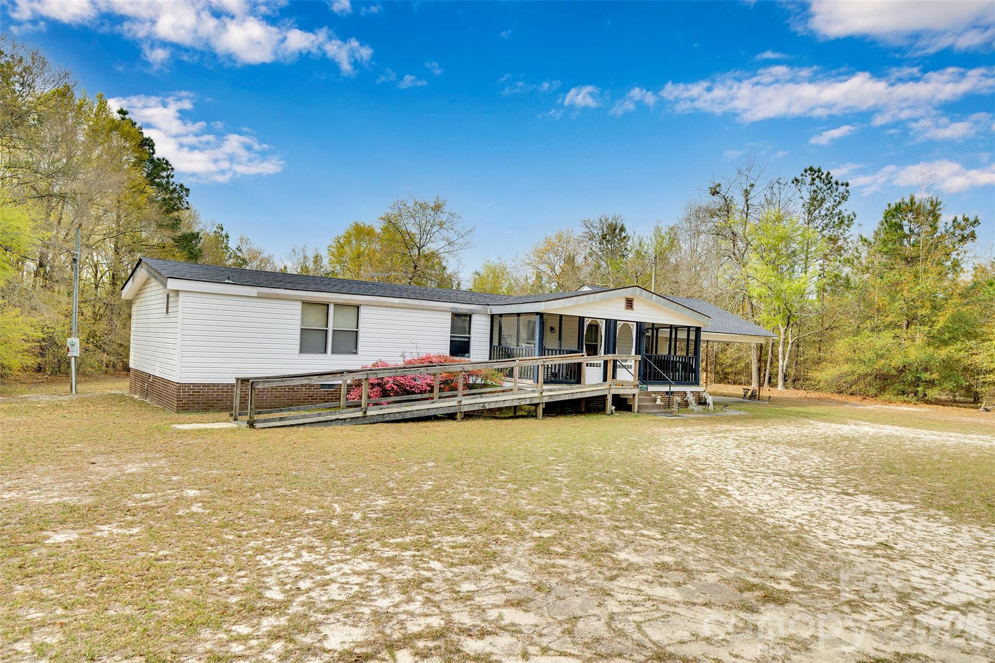 2187 McBee Highway Bethune, SC 29009 - Photo 3 of 38 a view of a house with swimming pool and sitting area