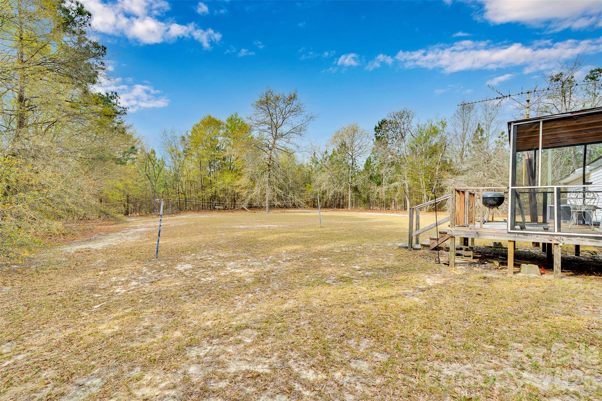 2187 McBee Highway Bethune, SC 29009 - Photo 32 of 38 a backyard of a house with table and chairs
