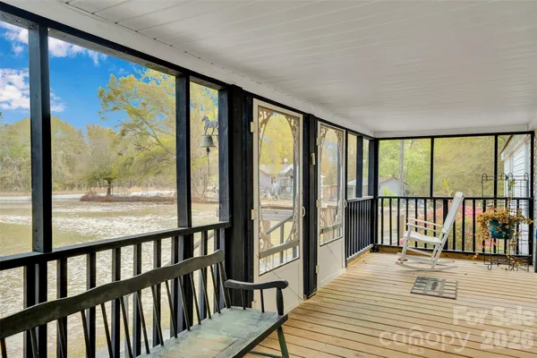 a view of a balcony with wooden floor