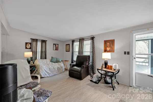 a bedroom with furniture and a window