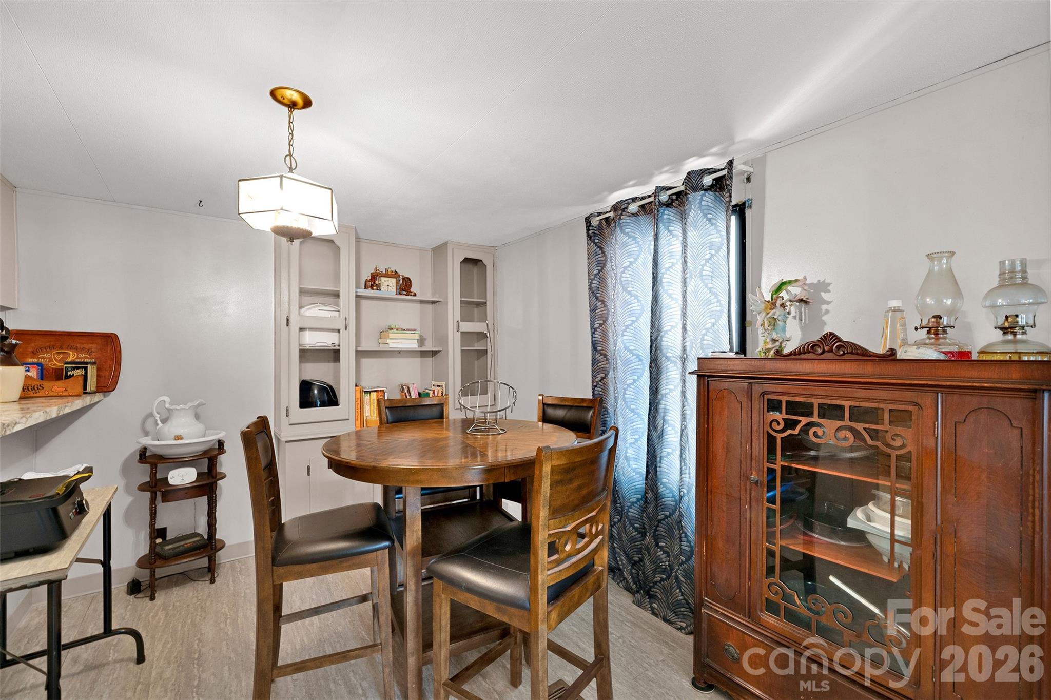 2187 McBee Highway Bethune, SC 29009 - Photo 8 of 38 a view of a dining room with furniture and chandelier