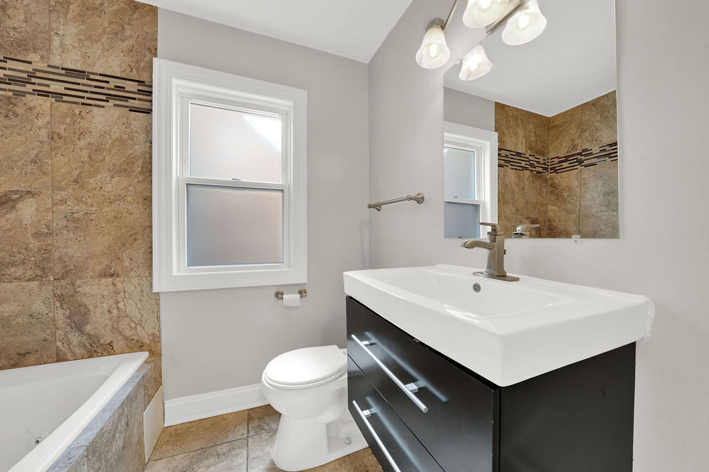 8033 South Campbell Avenue Chicago, IL 60652 - Photo 12 of 30 a bathroom with a sink toilet and mirror