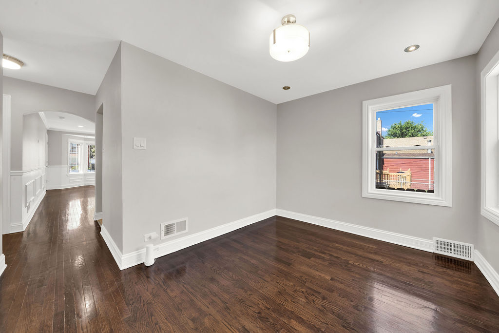8033 South Campbell Avenue Chicago, IL 60652 - Photo 14 of 30 an empty room with wooden floor and windows
