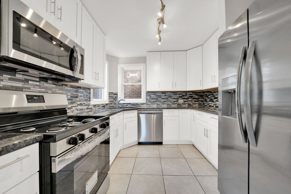 8033 South Campbell Avenue Chicago, IL 60652 - Photo 17 of 30 a kitchen with stainless steel appliances granite countertop a stove and a refrigerator