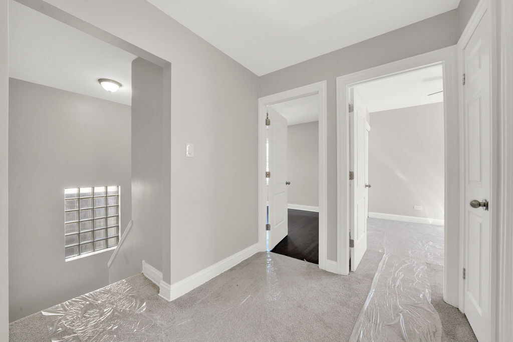 8033 South Campbell Avenue Chicago, IL 60652 - Photo 18 of 30 a view of an empty room with windows and wardrobe