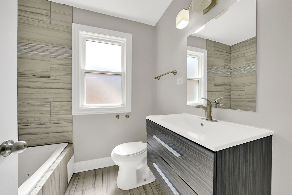 8033 South Campbell Avenue Chicago, IL 60652 - Photo 22 of 30 a bathroom with a sink and a toilet