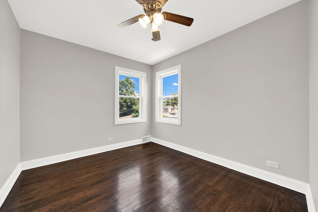 8033 South Campbell Avenue Chicago, IL 60652 - Photo 26 of 30 wooden floor in an empty room with a window