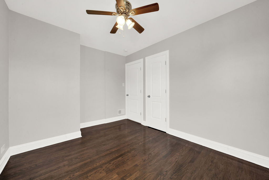 8033 South Campbell Avenue Chicago, IL 60652 - Photo 27 of 30 a view of an empty room with wooden floor