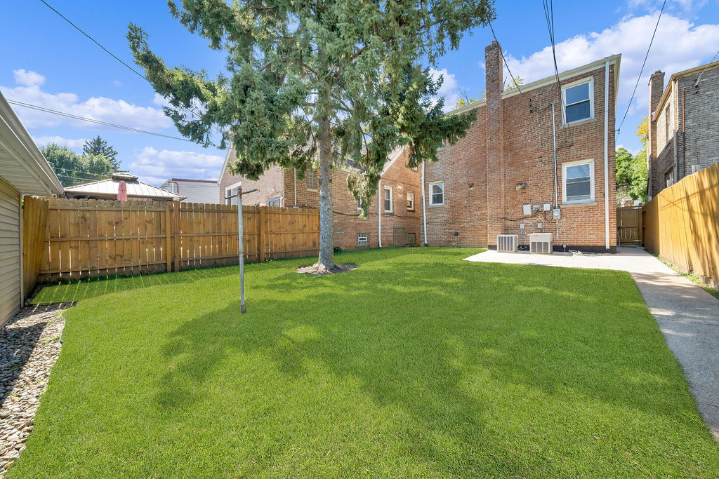 8033 South Campbell Avenue Chicago, IL 60652 - Photo 5 of 30 a view of a house with a yard and sitting area