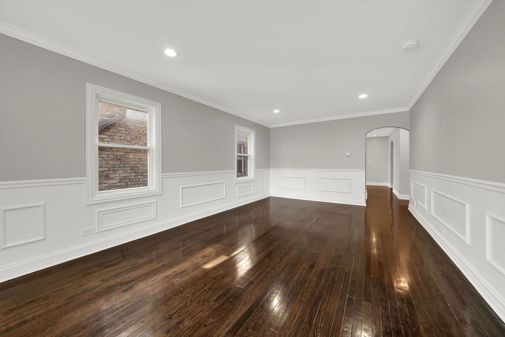 8033 South Campbell Avenue Chicago, IL 60652 - Photo 6 of 30 a view of empty room with wooden floor and fan