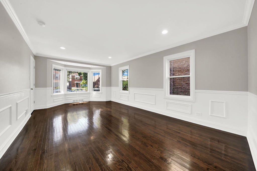 8033 South Campbell Avenue Chicago, IL 60652 - Photo 7 of 30 a view of an empty room with wooden floor and a window