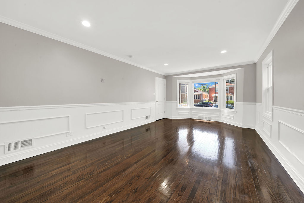 8033 South Campbell Avenue Chicago, IL 60652 - Photo 8 of 30 an empty room with wooden floor and windows