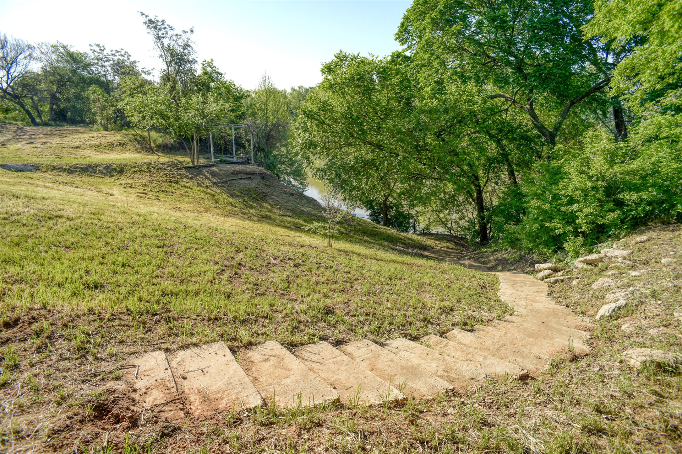 678 Ponderosa Road Bastrop, TX 78602 - Photo 26 of 40 Concrete steps leading to concrete dock at river level.