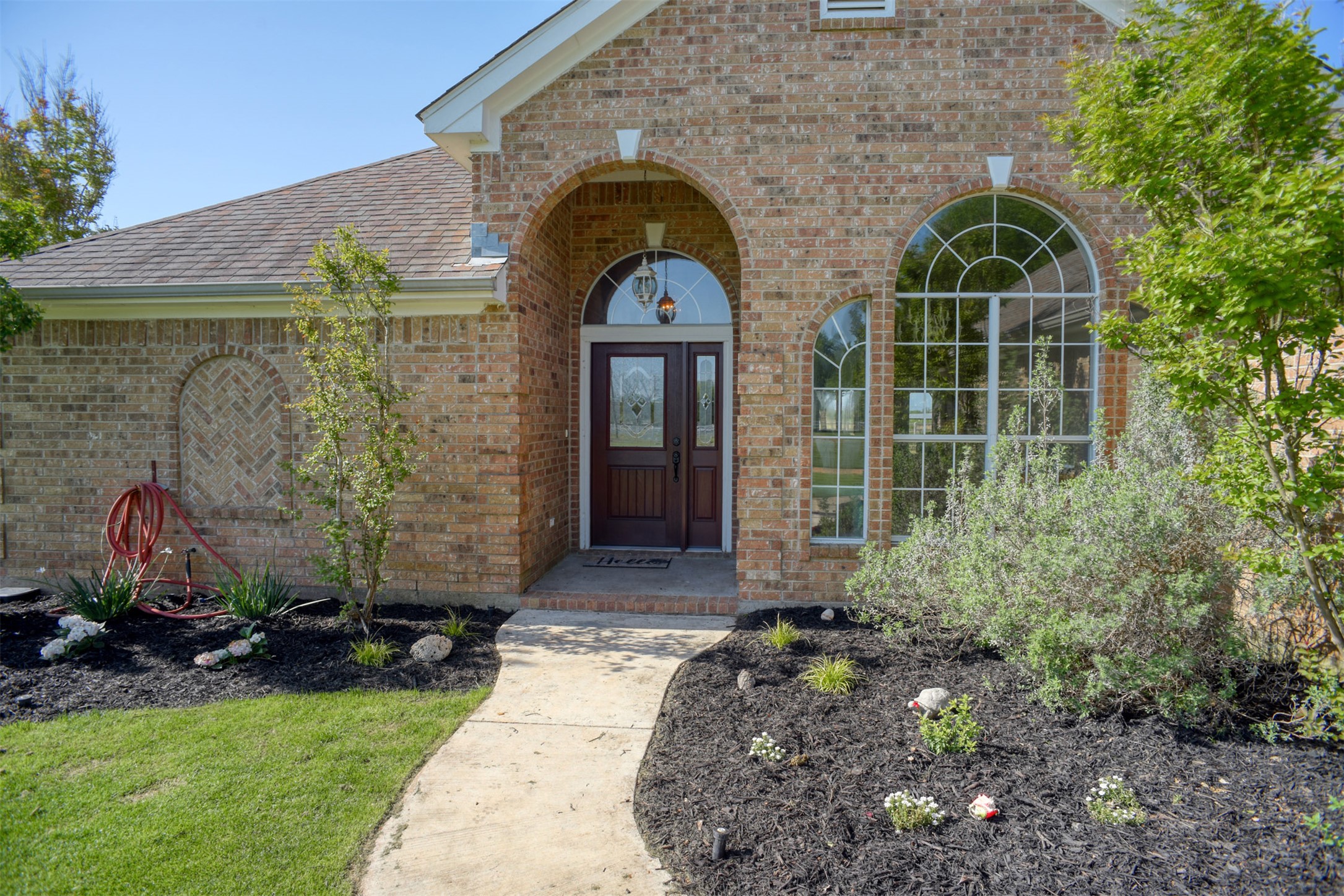 678 Ponderosa Road Bastrop, TX 78602 - Photo 4 of 40 Entry arch and front porch