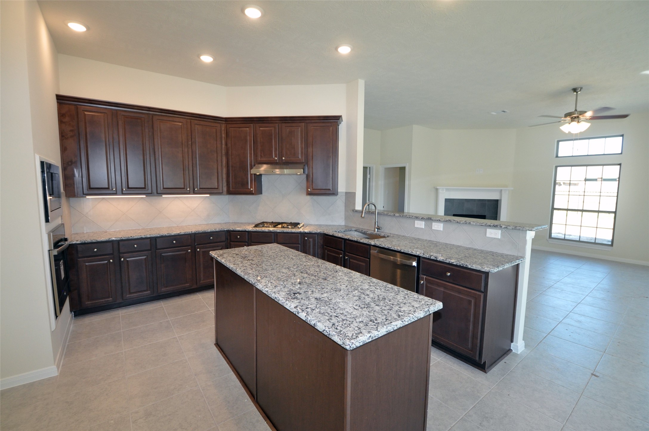 3705 Pedregal Road League City, TX 77573 - Photo 13 of 50 a kitchen with granite countertop a sink a counter top space and cabinets