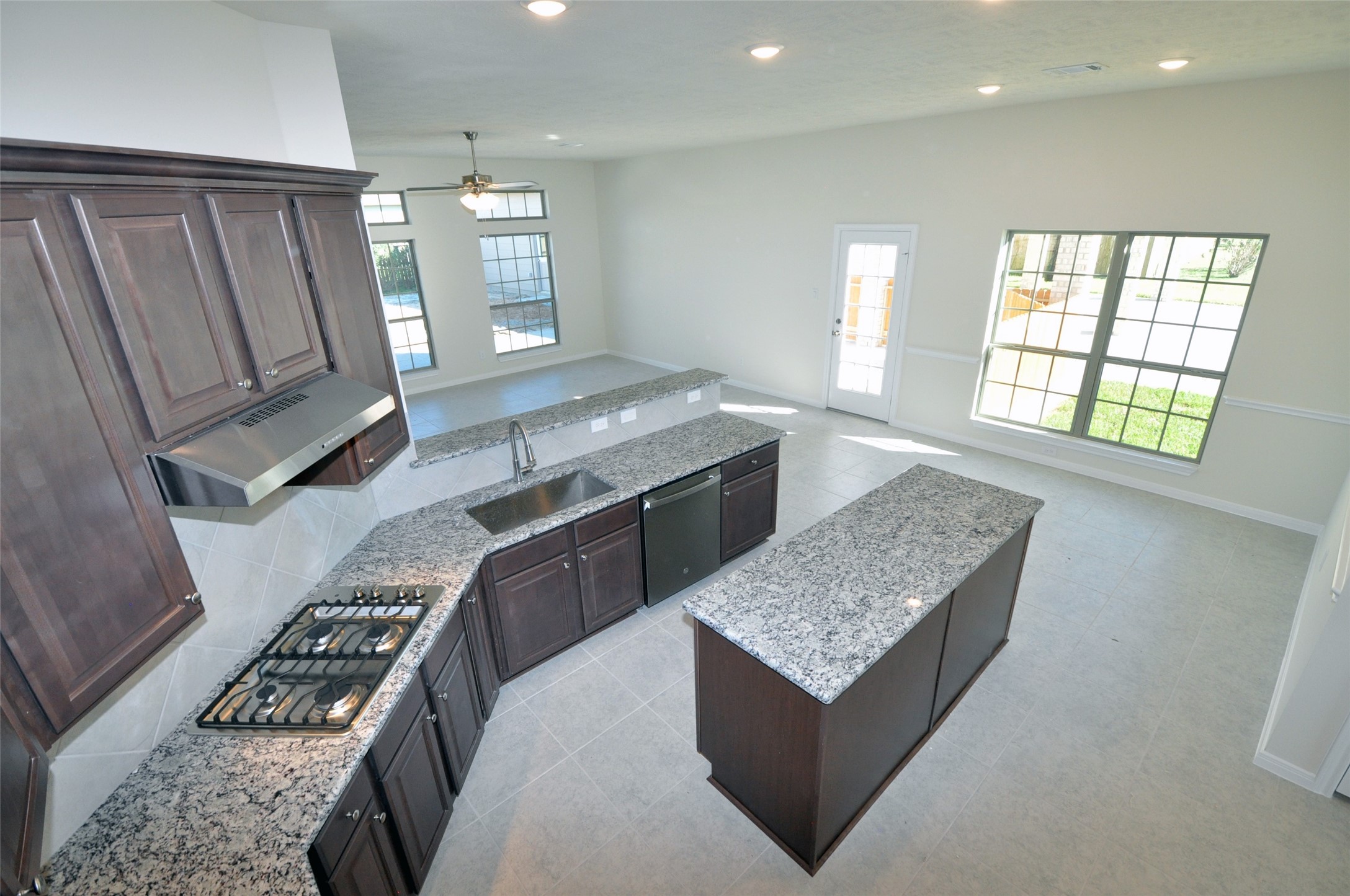 3705 Pedregal Road League City, TX 77573 - Photo 14 of 50 a kitchen with granite countertop a stove and a sink