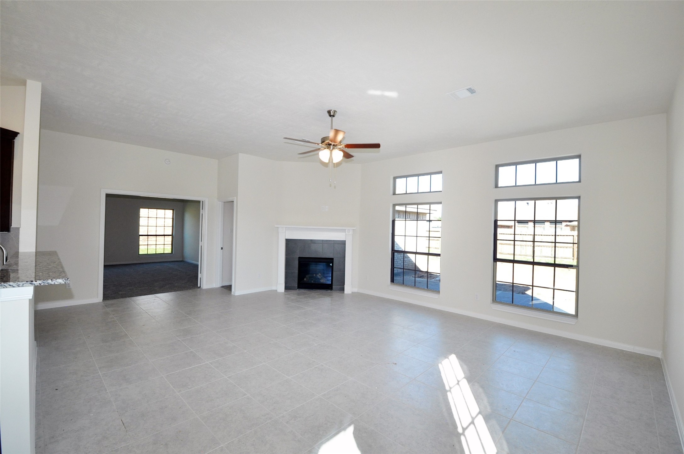 3705 Pedregal Road League City, TX 77573 - Photo 16 of 50 an empty room with windows and fireplace