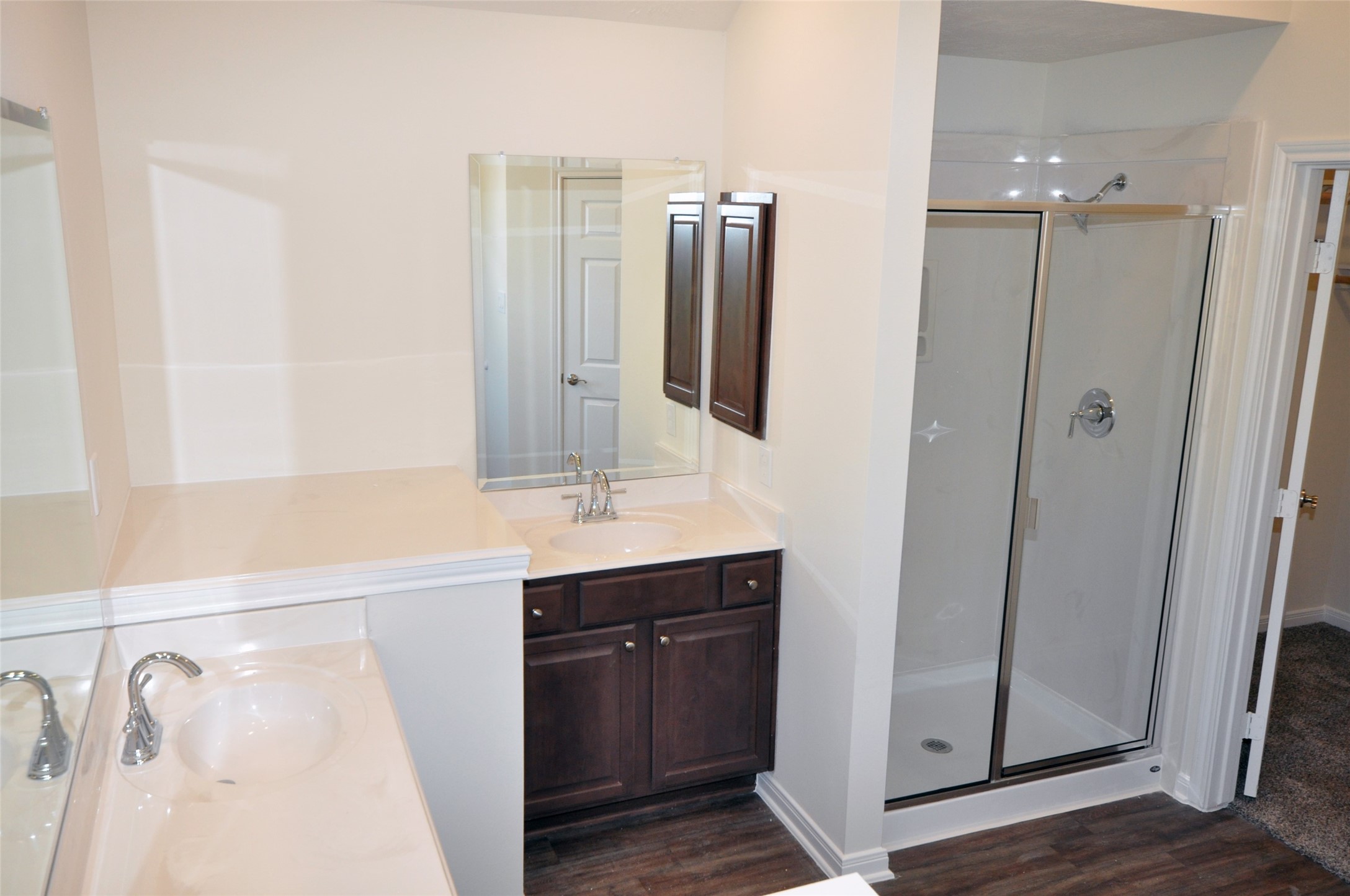 3705 Pedregal Road League City, TX 77573 - Photo 24 of 50 a bathroom with a double vanity sink a mirror and shower