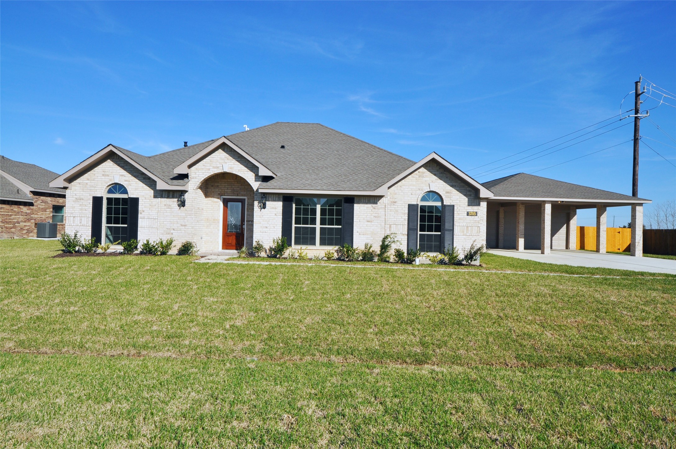 3705 Pedregal Road League City, TX 77573 - Photo 3 of 50 a front view of a house with a garden and porch
