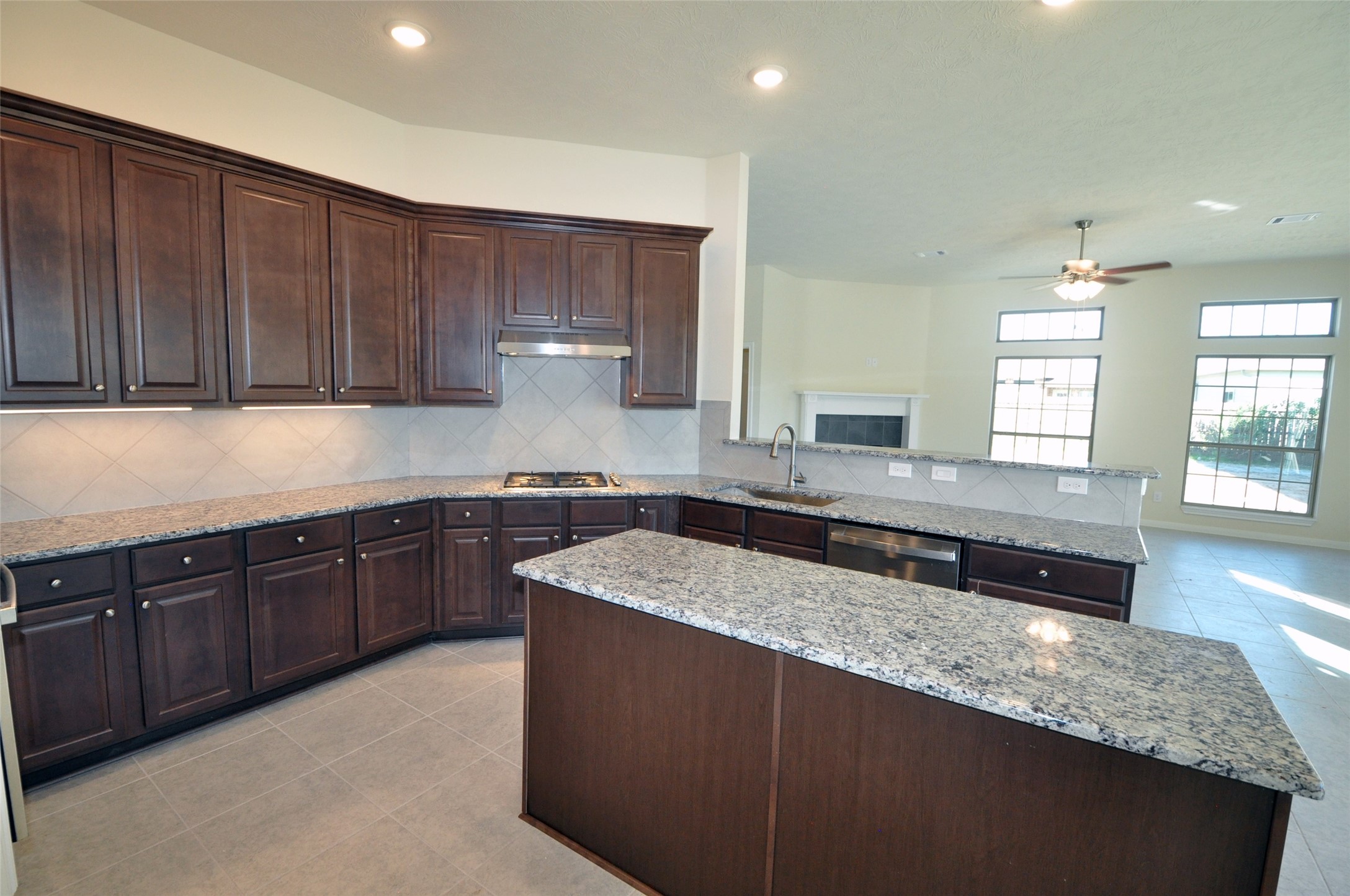 3705 Pedregal Road League City, TX 77573 - Photo 10 of 50 a kitchen with stainless steel appliances granite countertop wooden cabinets a sink and dishwasher