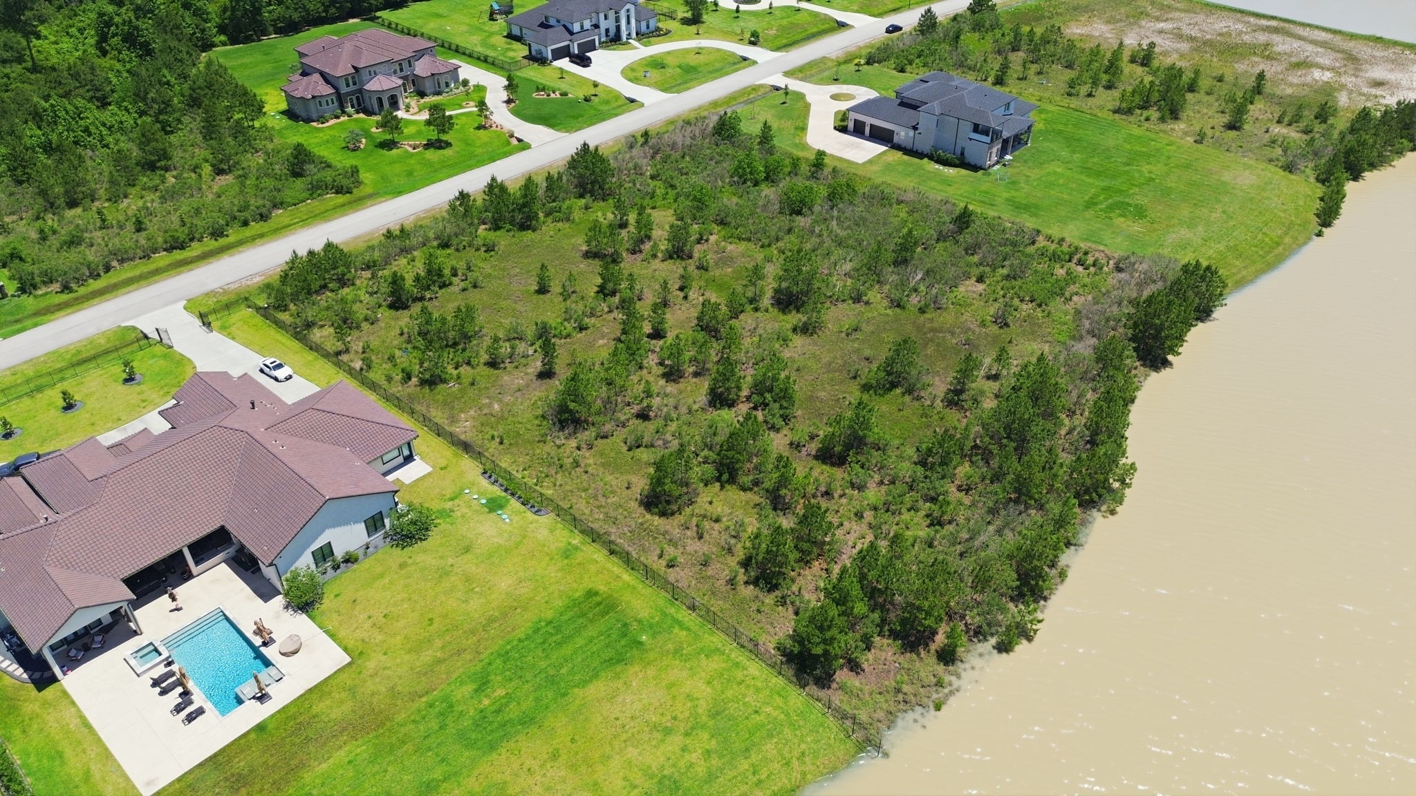 27539 South Lazy Meadow Way Spring, TX 77386 - Photo 3 of 31 Partially Wooded Lot sits on Natural Lake!