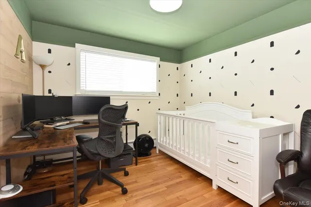 a bedroom with furniture and a window