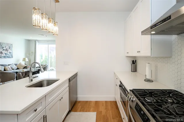 a kitchen that has a sink and a stove