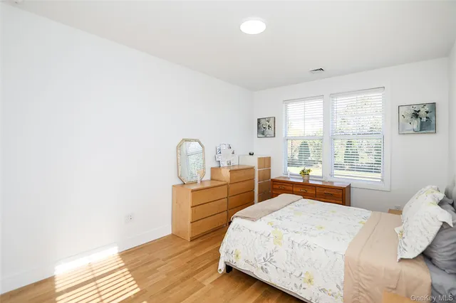 a bedroom with a bed and a table