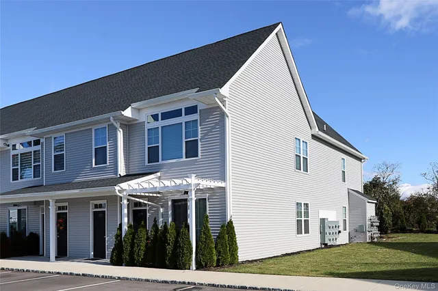 a view of a white building among the street