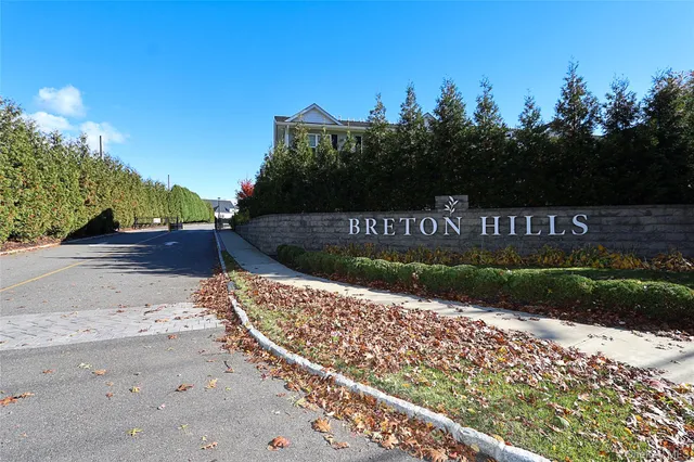 a view of a street with a bench in the background