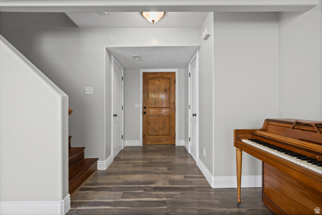 1346 Archmore Drive Springville, UT 84663 - Photo 9 of 32 Foyer featuring wood-finish flooring, white baseboards, and a wooden entry door