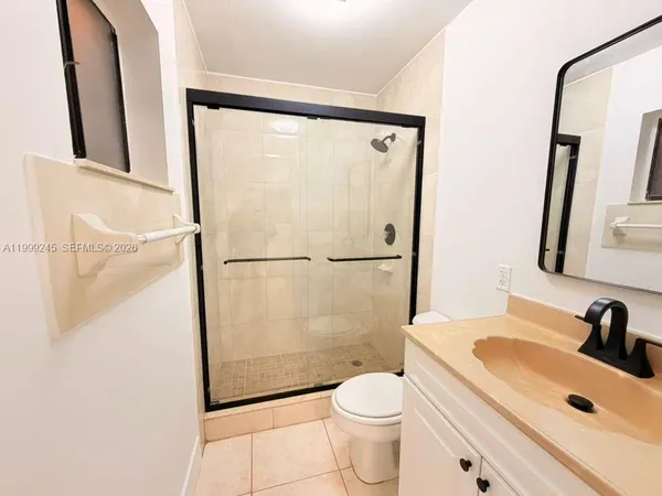 a bed room with a bed and a chair