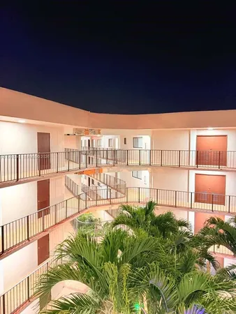 a view of a balcony with chairs