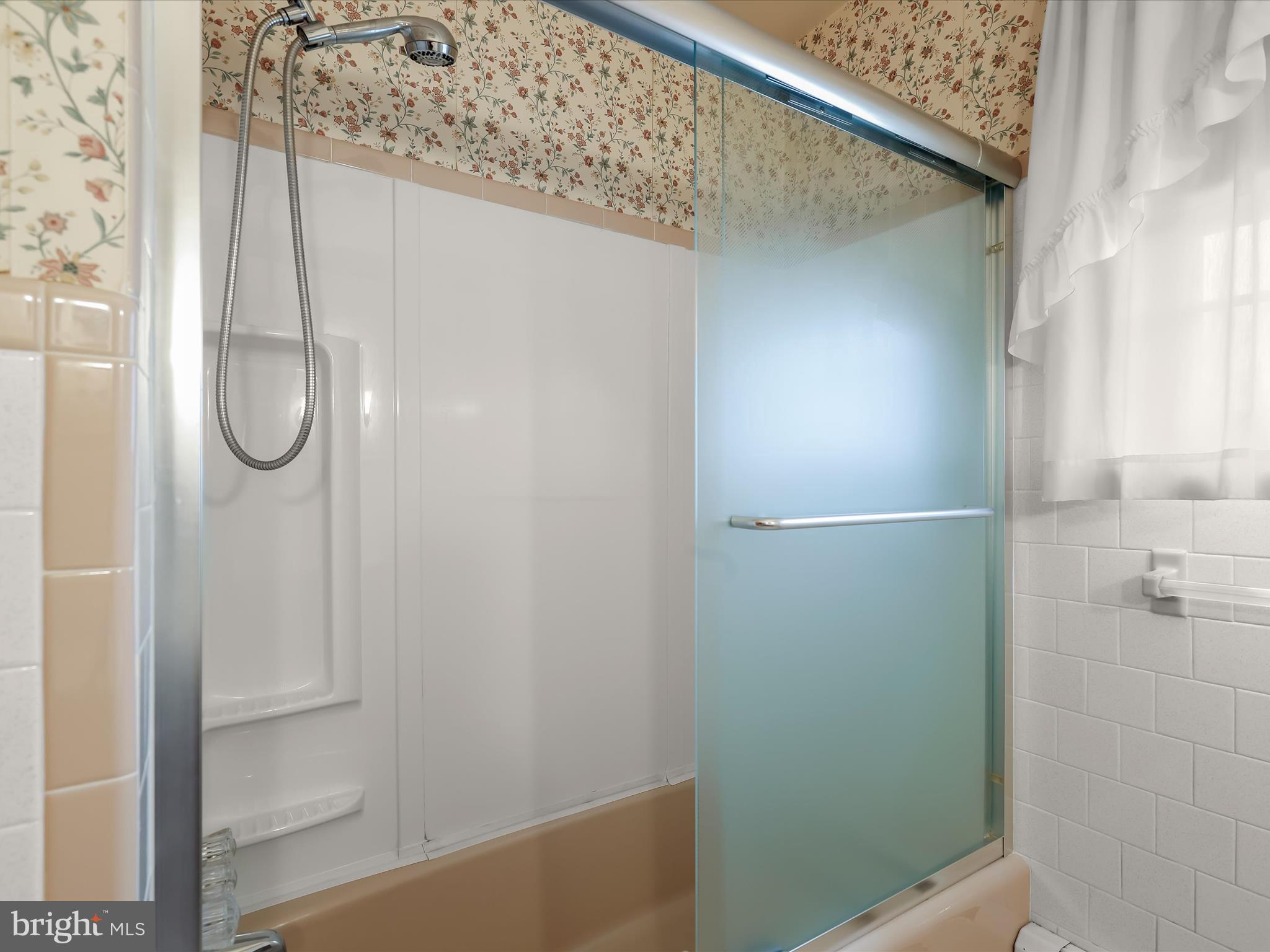 16215 Dark Hollow Road Upperco, MD 21155 - Photo 17 of 33 a bathroom with a glass shower door