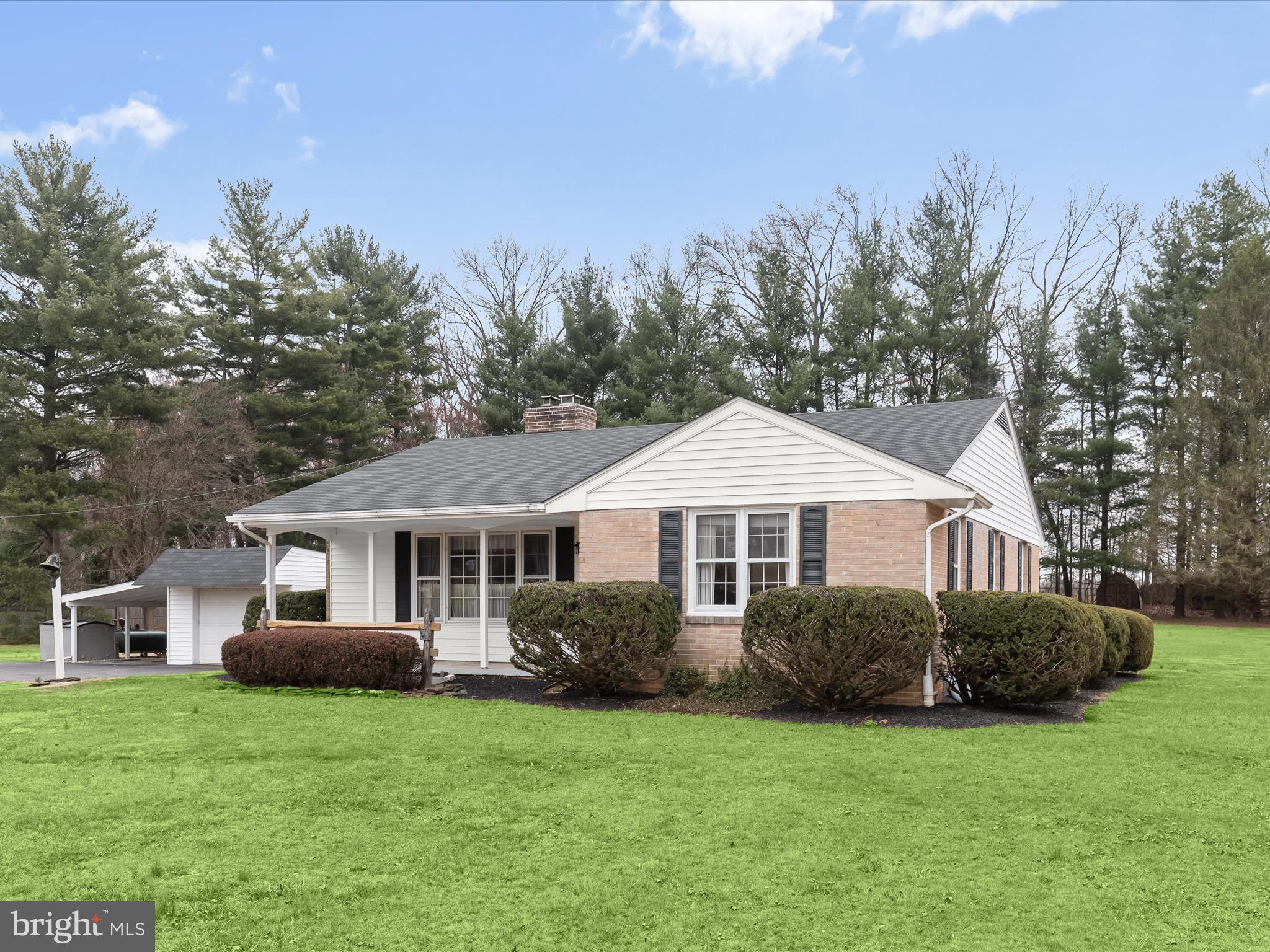 16215 Dark Hollow Road Upperco, MD 21155 - Photo 24 of 33 a front view of a house with a garden