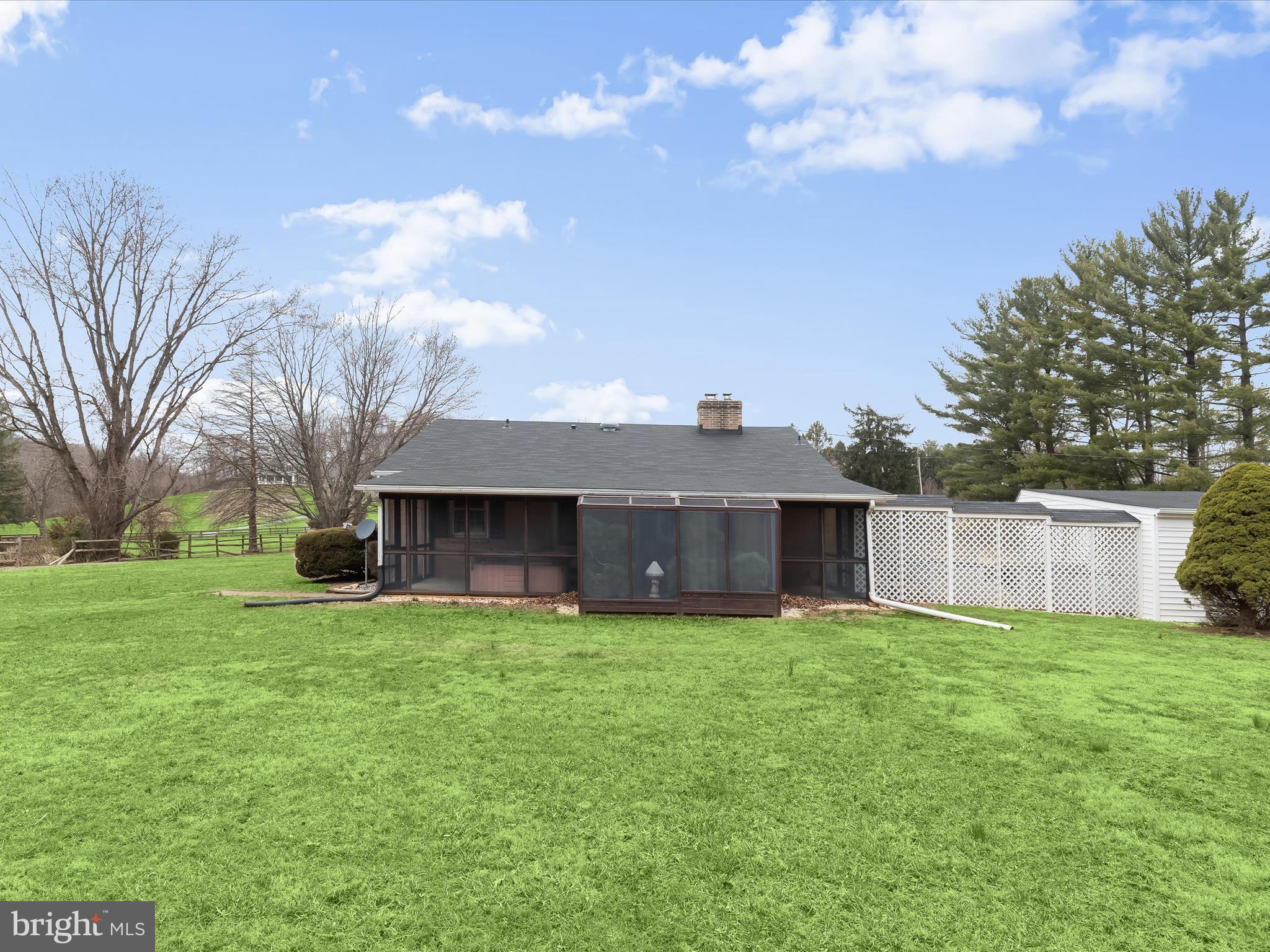 16215 Dark Hollow Road Upperco, MD 21155 - Photo 28 of 33 a view of a house with a yard and large trees