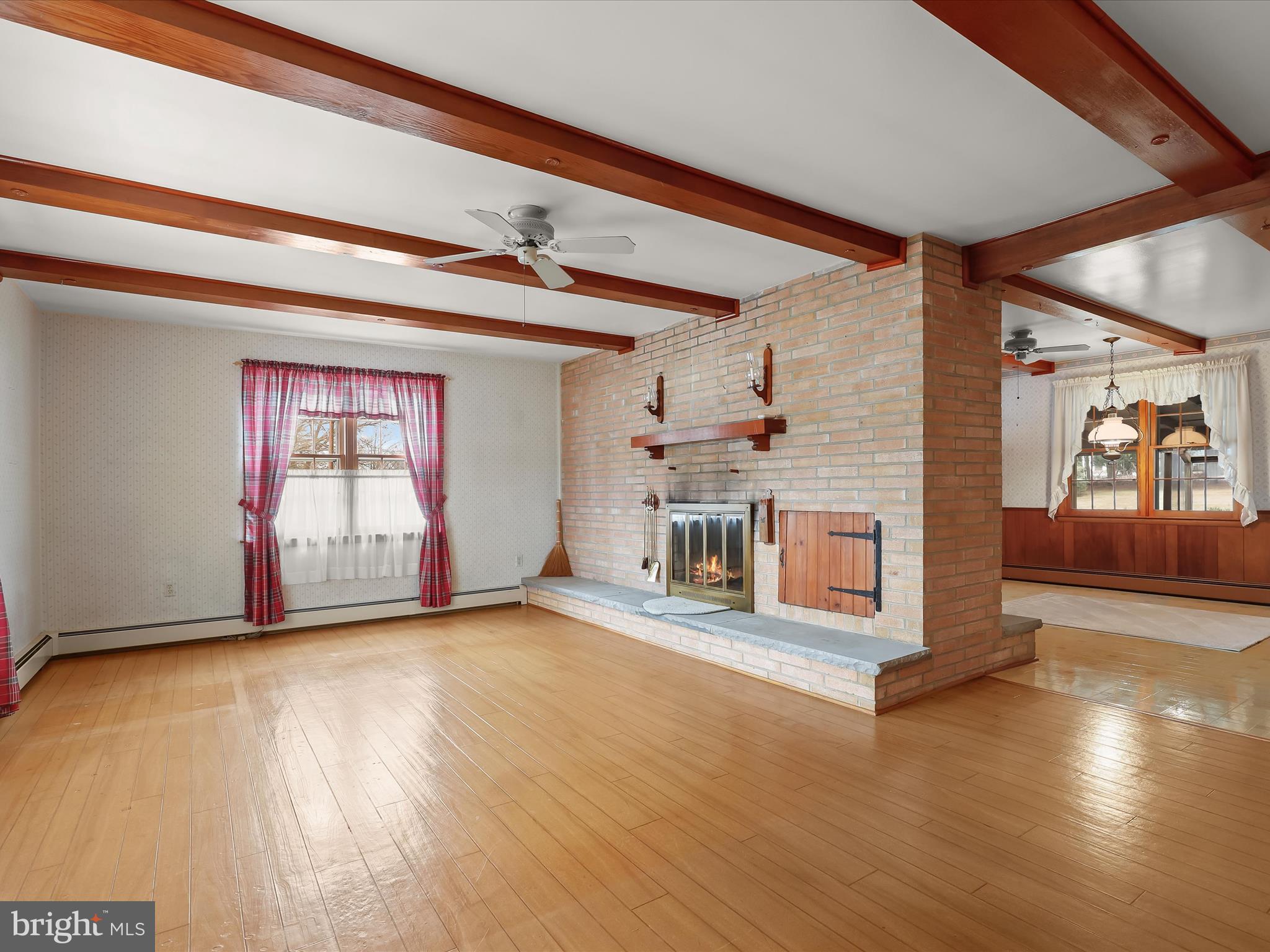 16215 Dark Hollow Road Upperco, MD 21155 - Photo 4 of 33 a view of an empty room with window and wooden floor