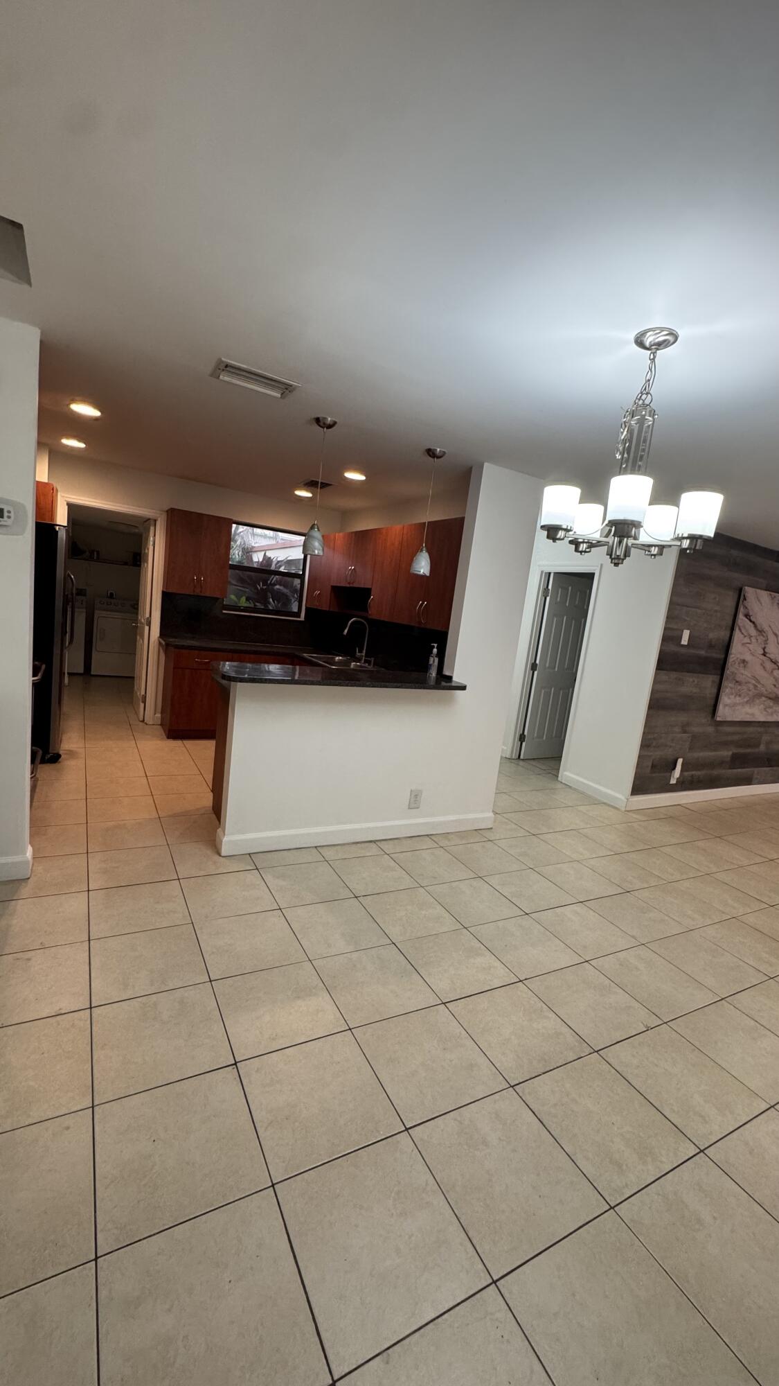 802 St Andrews Road, Unit 15 Hollywood, FL 33021 - Photo 21 of 53 a lobby with furniture and a chandelier
