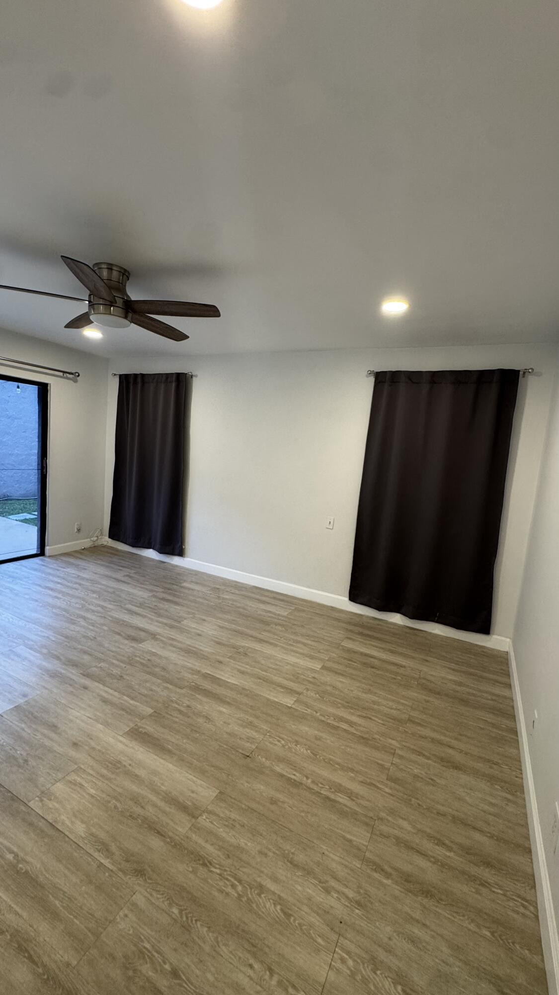 802 St Andrews Road, Unit 15 Hollywood, FL 33021 - Photo 38 of 53 a view of an empty room with wooden floor
