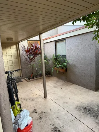 a view of a porch with furniture
