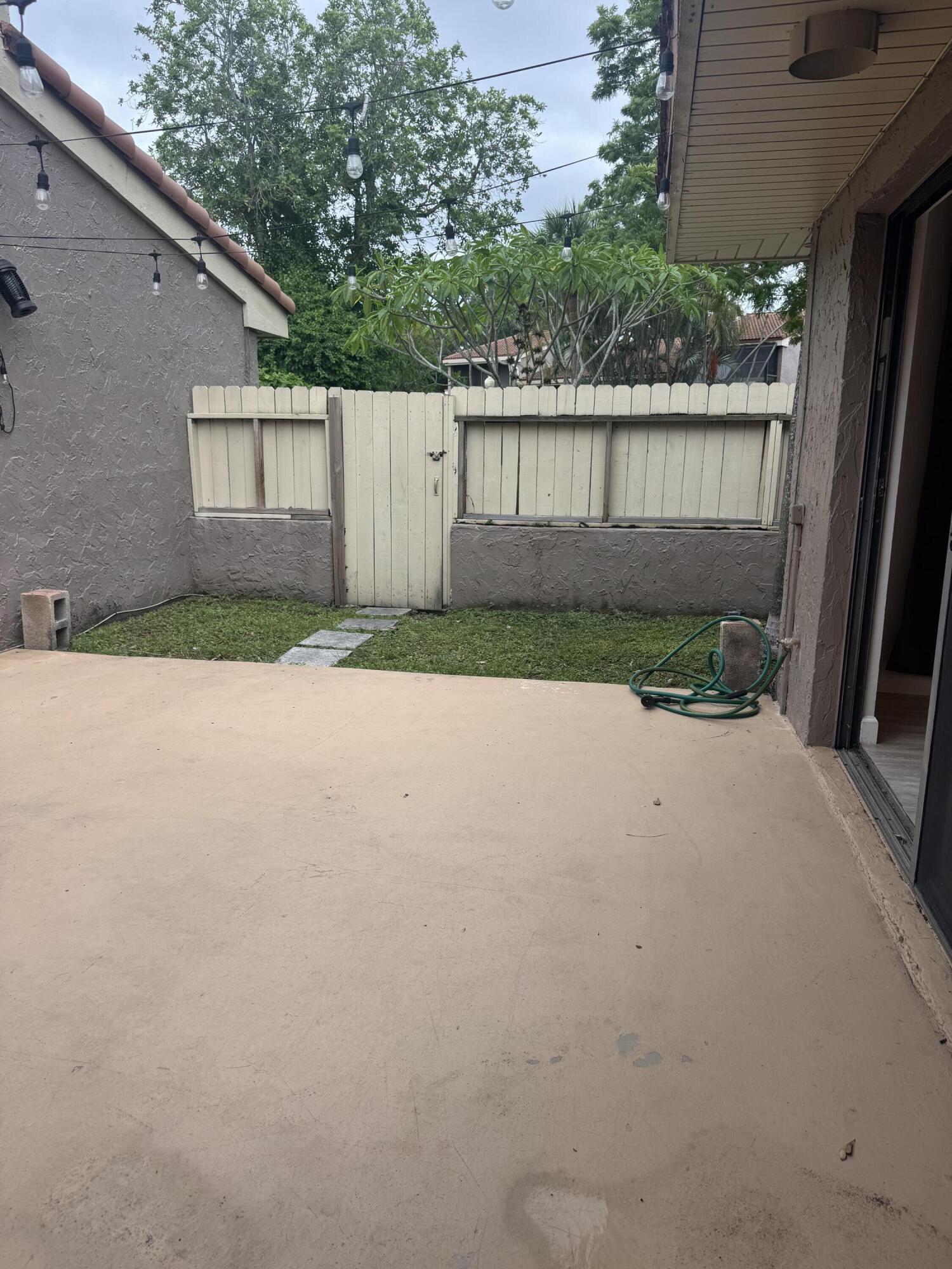 802 St Andrews Road, Unit 15 Hollywood, FL 33021 - Photo 52 of 53 a front view of a house with a yard and garage