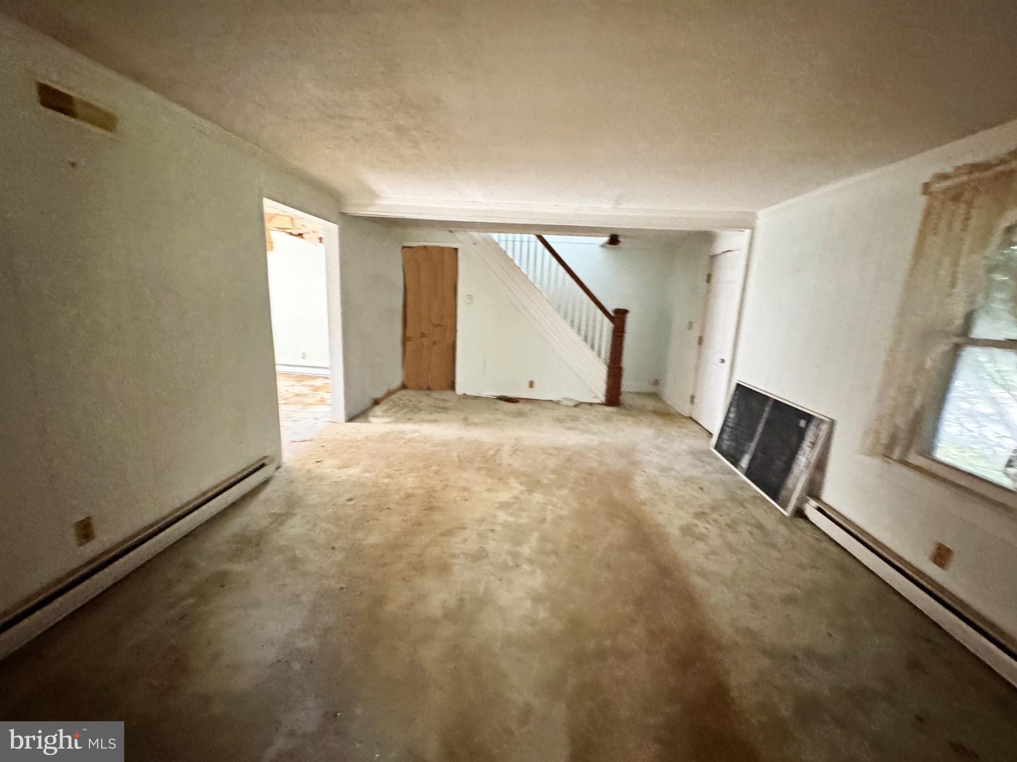 7130 Parsonsburg Road Parsonsburg, MD 21849 - Photo 6 of 10 a view of a livingroom with an empty space and a window